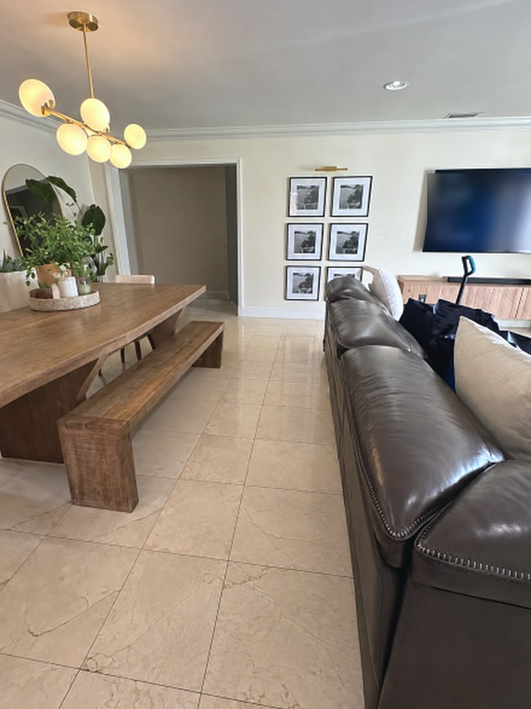 The same living and dining area without the boxes, the floor clear again